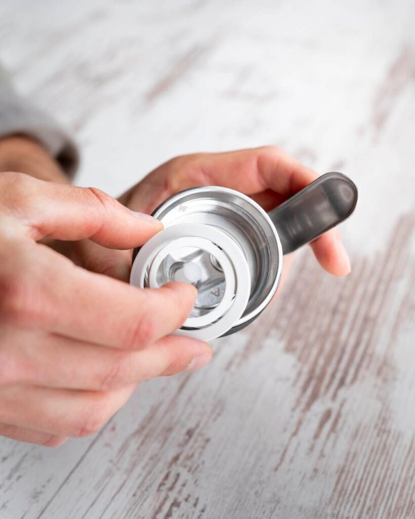 Insert gasket into the head of the cream dispenser appliance